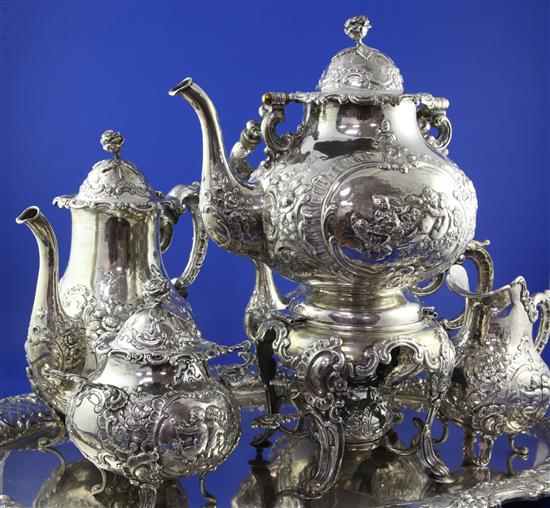 A large ornate late 19th century German Hanau six piece silver tea and coffee service, gross approx. 329 oz.